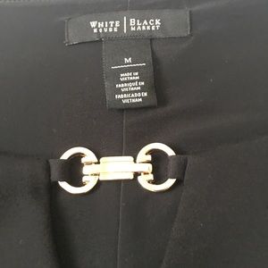 Black, long sleeve dress w/ gold embellishment.